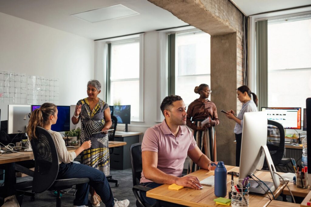 Colleagues Engaged in Office Tasks